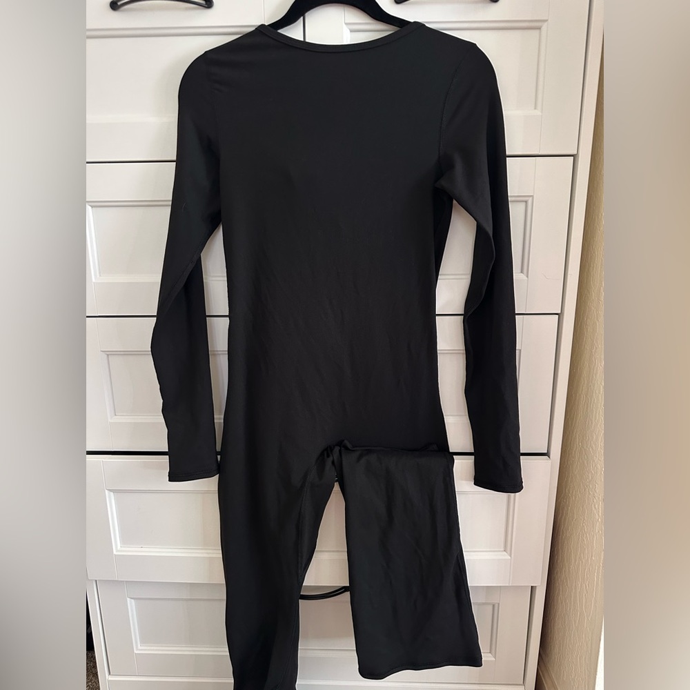 Qincen Women’s open back long sleeve tight jumpsuit Size M